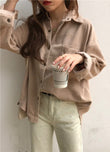 Person wearing a beige corduroy shirt holding a coffee cup against a plain background Women's Oversized Corduroy Shacket – Loose Fit Button-Down Shirt Jacket Shirt Jackets mpncm1-10.myshopify.com womens-oversized-corduroy-shacket-loose-button-down Fittyluxe