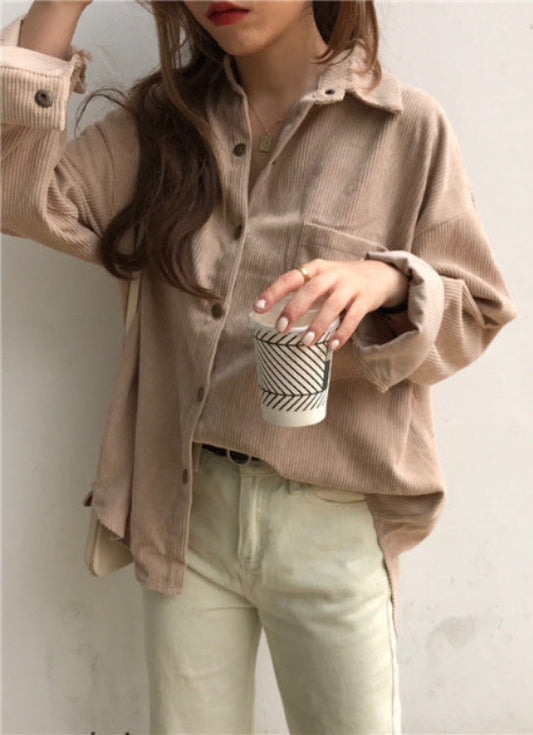 Person wearing a beige corduroy shirt holding a coffee cup against a plain background Women's Oversized Corduroy Shacket – Loose Fit Button-Down Shirt Jacket Shirt Jackets mpncm1-10.myshopify.com womens-oversized-corduroy-shacket-loose-button-down Fittyluxe