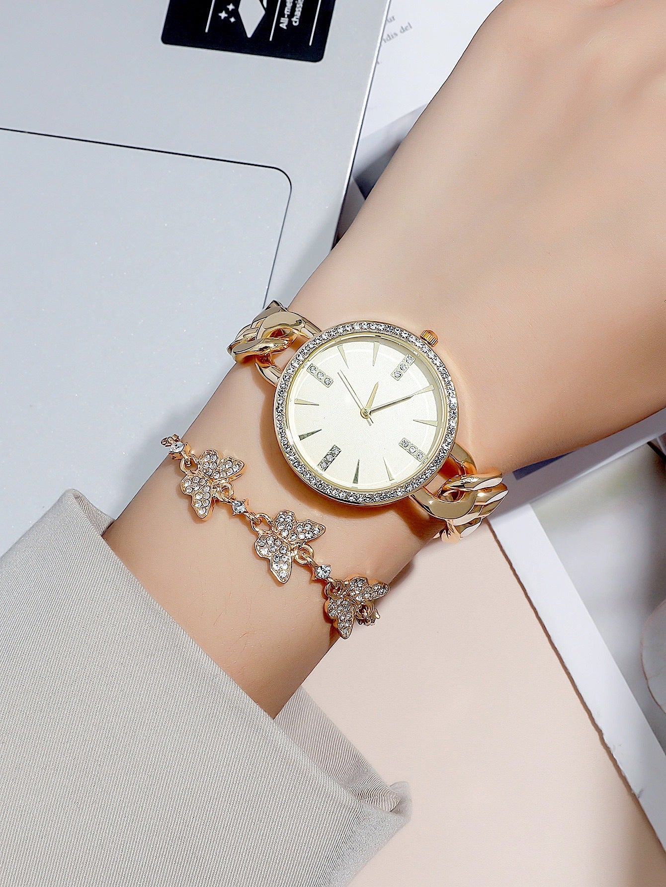 Gold wristwatch with diamond accents on a wrist, with a blurred background Women's Casual Thin Mesh Strap Watch – Minimalist Round Dial Bracelet Set Casual Watches mpncm1-10.myshopify.com womens-thin-strap-mesh-watch-bracelet-set-minimalist Fittyluxe